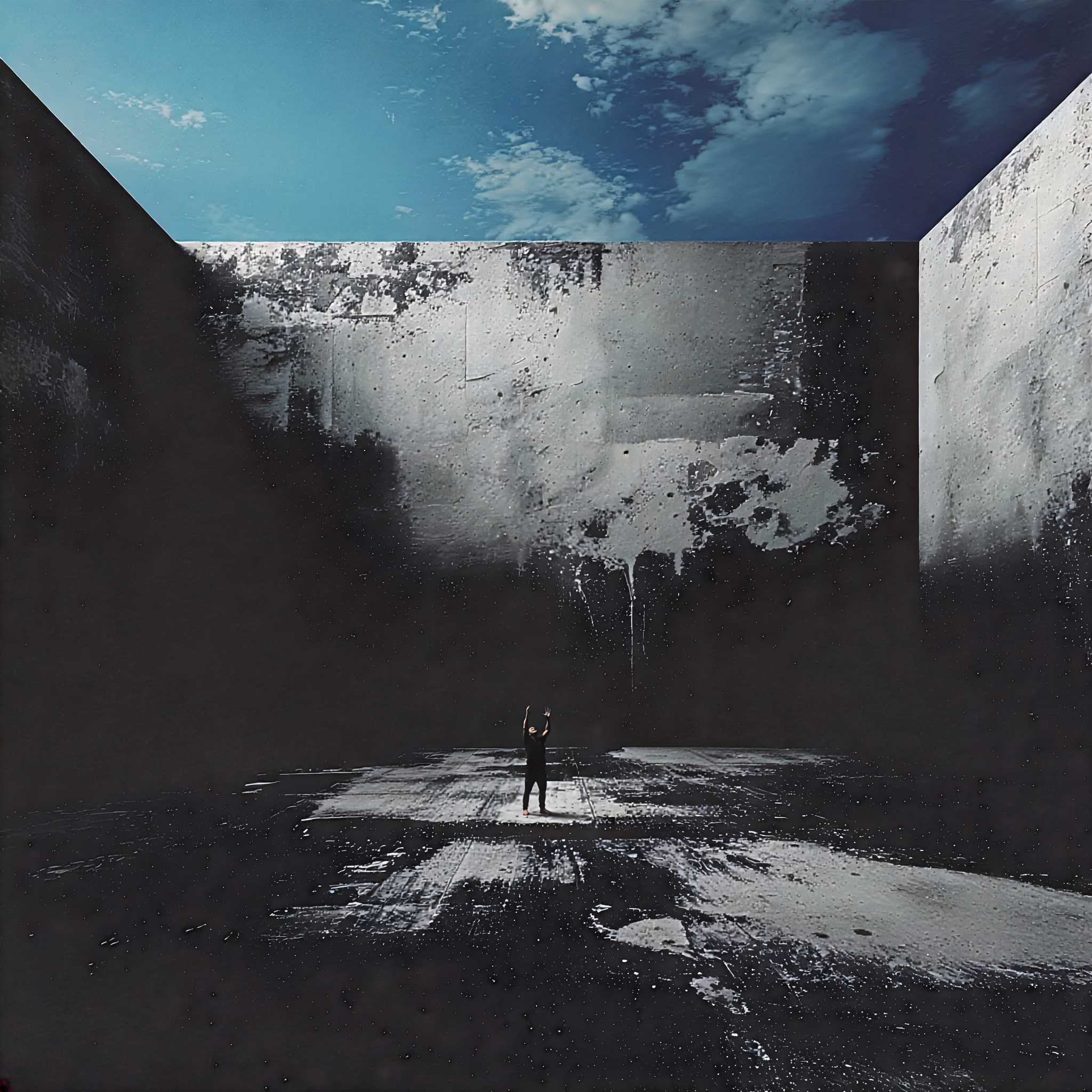 An empty concrete enclosure with towering weathered walls open to a pale clouded sky, its dark floor streaked with faint light, rendered in cold desaturated tones of gray and teal.